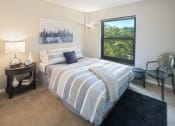 Thumbnail 12 of 39 - Bedroom with window with a view of the city at Eden Commons, Chicago, Illinois