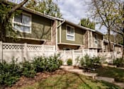 Thumbnail 29 of 40 - Townhome style units with decorative fence and steps at The Brook At Columbia Apartments, Maryland