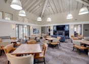 Thumbnail 10 of 15 - Dining area with fireplace at VINTAGE AT BENNETT VALLEY, Santa Rosa