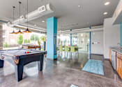 Thumbnail 5 of 26 - Community Room view of Pool Table and Kitchen Area at Greenway at Fisher Park, Greensboro, 27401