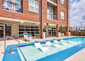 Thumbnail 13 of 26 - Swimming Pool With Relaxing Sundecks at Greenway at Fisher Park, North Carolina