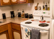 Thumbnail 11 of 33 - the kitchen with a white stove