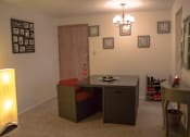 Thumbnail 3 of 33 - a dining room with a table and a chair and a side table