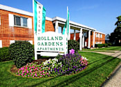 Thumbnail 9 of 27 - the sign in front of an apartments building