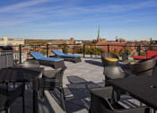 Thumbnail 19 of 23 - Rooftop Deck with Gas Fire Pit and Grilling Station at The News Apartments in Troy, NY