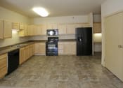 Thumbnail 15 of 26 - Kitchen with cabinets at Stonebridge Villas Apartments, Minot, ND, 58703