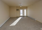 Thumbnail 23 of 26 - living area, patio door area at Stonebridge Villas Apartments, Minot, ND, 58703