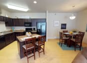 Thumbnail 2 of 26 - kitchen, island, dining at Stonebridge Villas Apartments, Minot, 58703