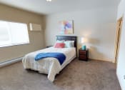 Thumbnail 7 of 26 - Bedroom with bed at Stonebridge Villas Apartments, North Dakota