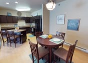 Thumbnail 5 of 26 - kitchen, dining area, furnished at Stonebridge Villas Apartments, Minot, ND, 58703
