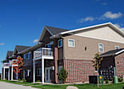 Thumbnail 1 of 40 - exterior of moorhead apartment, blue sky, green grass