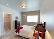 Thumbnail 14 of 40 - bedroom with dresser and bed, moorhead apartment