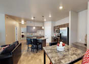 Thumbnail 7 of 40 - kitchen with brown cabinets, stainless steel appliances