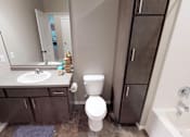 Thumbnail 10 of 40 - bathroom, sink, toilet, linen closet, apartment in moorhead
