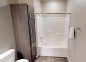 Thumbnail 11 of 40 - shower, linen closet, moorhead apartment