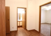 Thumbnail 13 of 18 - Image of master bedroom with vinyl plank flooring and bathroom