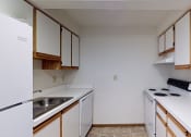 Thumbnail 5 of 18 - Image of a kitchen with cabinets and appliances