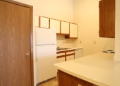 Thumbnail 3 of 18 - Image of a kitchen with cabinets and appliances