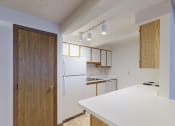 Thumbnail 11 of 18 - Image of kitchen with cabinets, island, and appliances