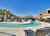 Thumbnail 1 of 32 - Swimming Pool with Lounge Chairs at La Contessa Luxury Apartments, Laredo,Texas