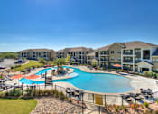 Thumbnail 14 of 32 - Infinity-Edge Pool with Cabanas at La Contessa Luxury Apartments, Texas