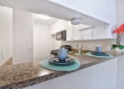 Thumbnail 20 of 36 - Fairway Manor Apartment Homes Kitchen Area