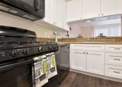 Thumbnail 24 of 36 - Fairway Manor Apartment Homes Kitchen Area