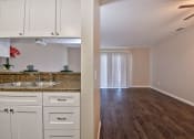 Thumbnail 26 of 36 - Fairway Manor Apartment Homes Kitchen-Living Area