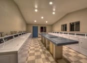 Thumbnail 3 of 21 - Windwood Apartment Homes Laundry Facilities