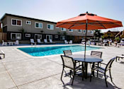 Thumbnail 5 of 22 - Pool with Lounge Chairs at ETHAN TERRACE, Sacramento, 95825