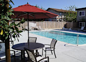 Thumbnail 6 of 22 - Pool with Lounge Chairs at ETHAN TERRACE, Sacramento, CA 95825