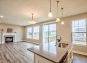 Thumbnail 28 of 45 - Kitchen and living room of Home For Rent in Holt Michigan | Aspen Lakes Estates