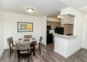 Thumbnail 7 of 11 - View of dining room and kitchen entrance.