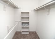 Thumbnail 9 of 11 - View of walk-in closet with built-in shelving.