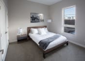 Thumbnail 2 of 37 - A bedroom with a bed and two nightstands at RoCo Apartments, Fargo, North Dakota 58102