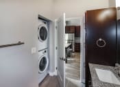 Thumbnail 3 of 37 - A bathroom with a washer and dryer  at RoCo Apartments, Fargo, ND 58102