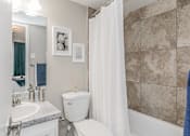 Thumbnail 25 of 39 - Contemporary bathroom with large mirror and modern lighting