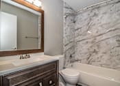 Thumbnail 5 of 28 - Bathroom with modern vanity and bright mirror lighting at Verano Oaks