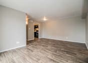 Thumbnail 4 of 28 - Open living and dining area with neutral tones and modern flooring