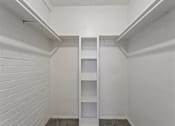 Thumbnail 13 of 28 - Walk-in closet with built-in shelving at Verano Oaks Apartments