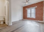 Thumbnail 12 of 14 - Brick wall and window view and bathroom