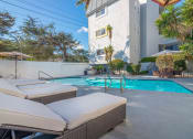 Thumbnail 6 of 8 - Pool and furnished lounging area