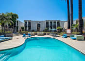 Thumbnail 4 of 20 - Swimming Pool And Relaxing Area at Parc at 5 Apartments, Downey, CA