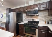 Thumbnail 15 of 20 - Fully Furnished Kitchen at Parc at 5 Apartments, Downey, 90240