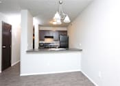 Thumbnail 8 of 18 - looking into kitchen from living room