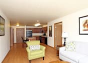Thumbnail 7 of 12 - A living room with wood vinyl plank flooring