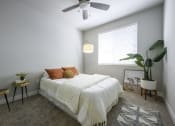 Thumbnail 19 of 34 - Bedroom with Bed and Fan