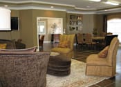 Thumbnail 2 of 8 - Clubhouse with Brown Furniture at Tyler Ridge, Mobile, AL