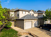 Thumbnail 1 of 21 - 2 Bedroom Townhome with trees and grass
