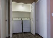 Thumbnail 22 of 26 - Laundry closet with full sized washer and dryer